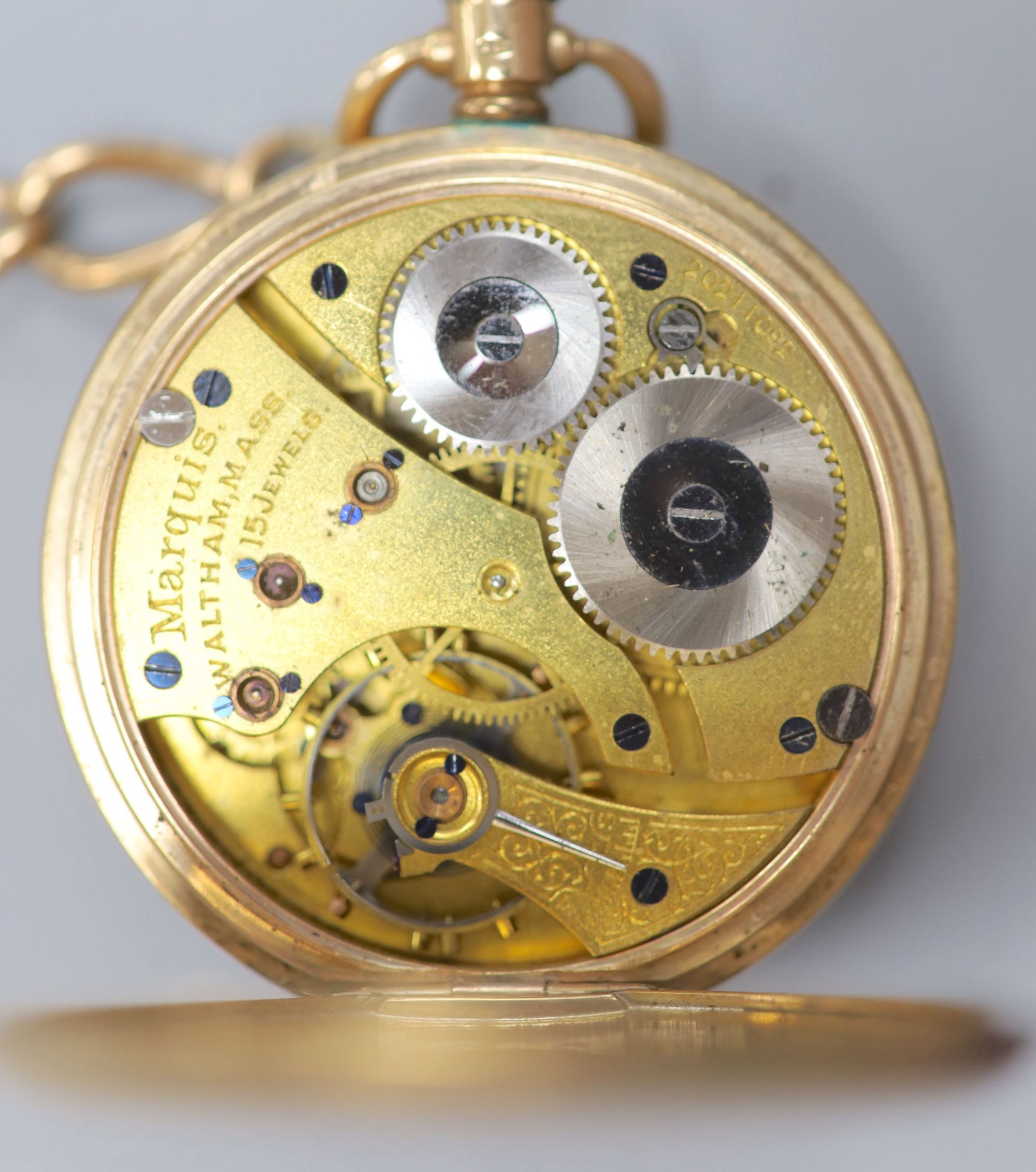 A George V 9ct gold Waltham half hunter pocket watch, with a 9ct gold albert.